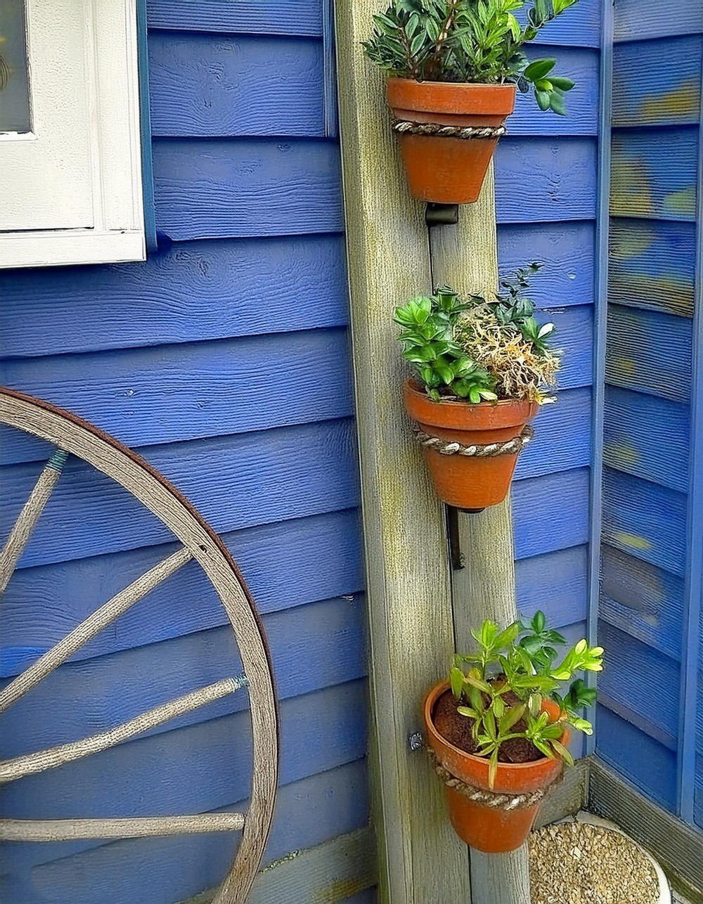 Elevate Your Porch with a Reclaimed Wood Vertical Planter