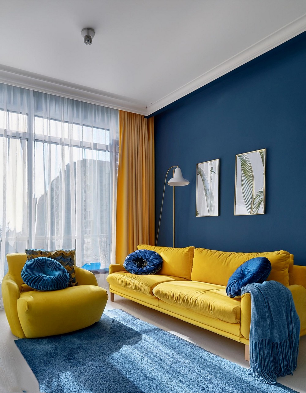 Sunny Yellow Sofas with Royal Blue Throws